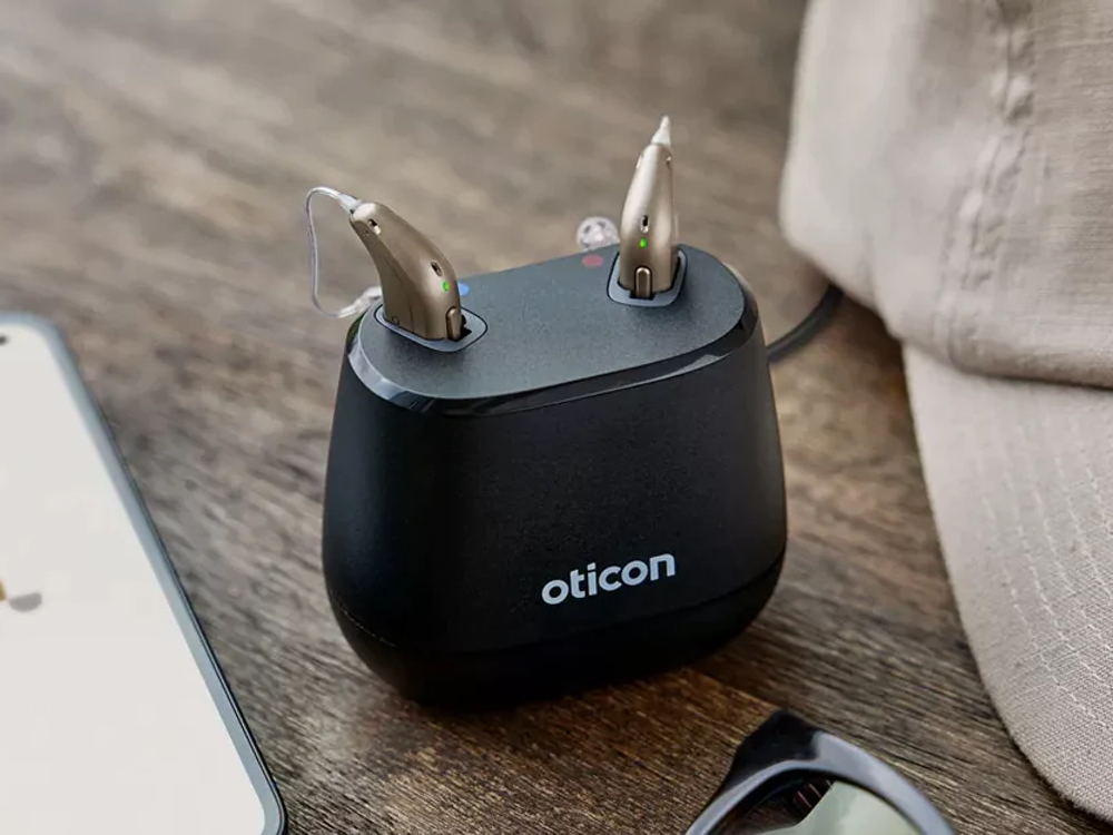 Rechargeable hearing aids charging overnight, an alternative to disposable batteries at Hughes Holistic Audiology in Zionsville, IN
