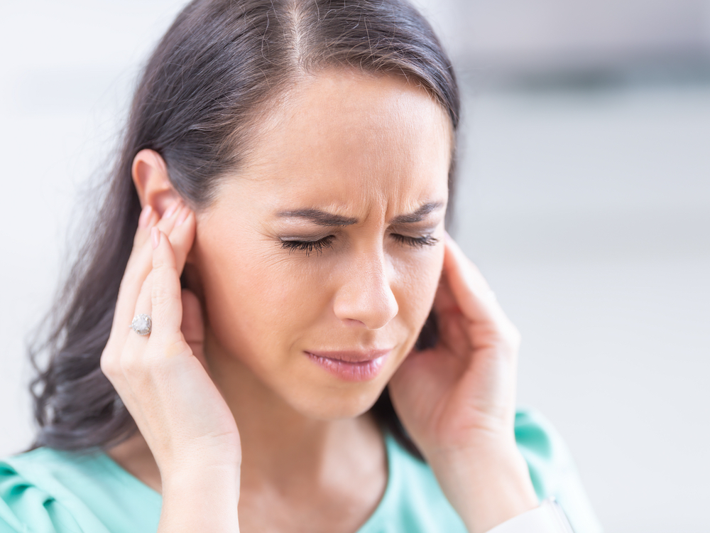 Patient being evaluated for tinnitus and ringing in the ears at Hughes Holistic Audiology in Zionsville, IN